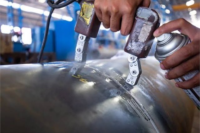 Magnetic particle inspection in progress